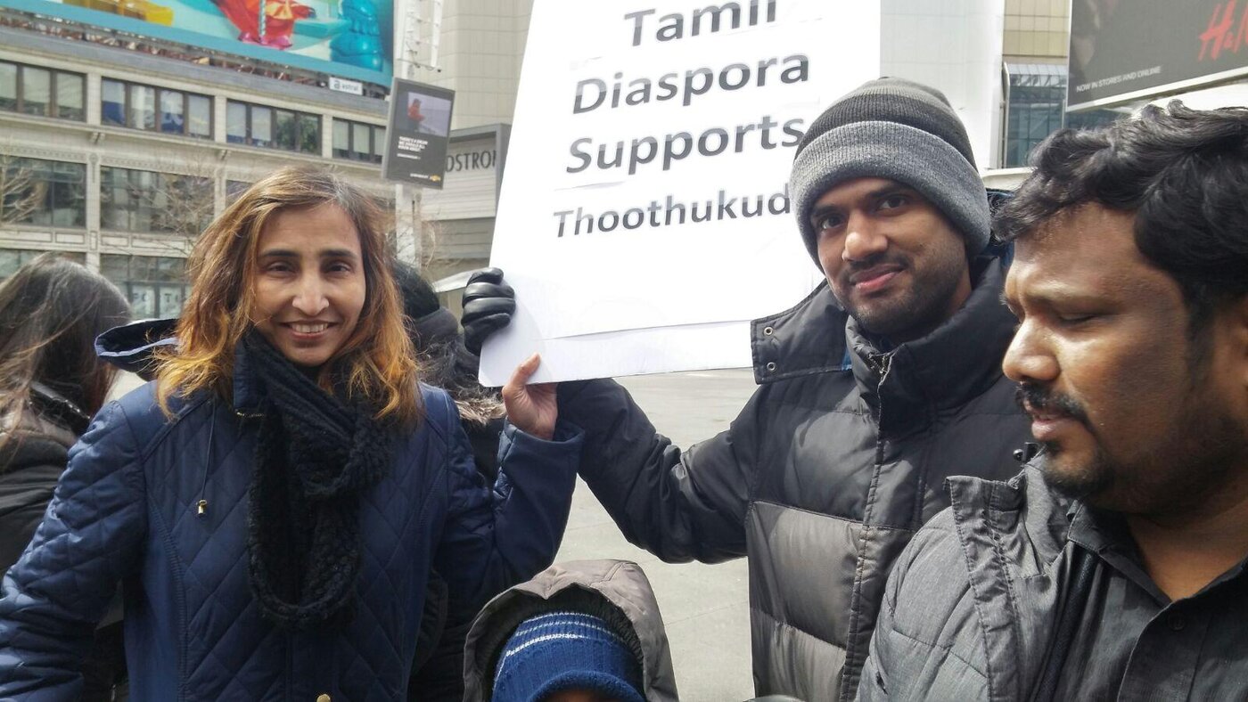 Naila standing up for the community at an outdoor event