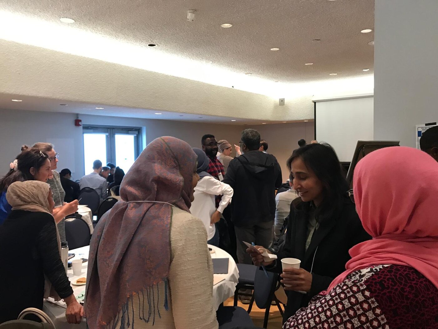 Naila in conversation with community members