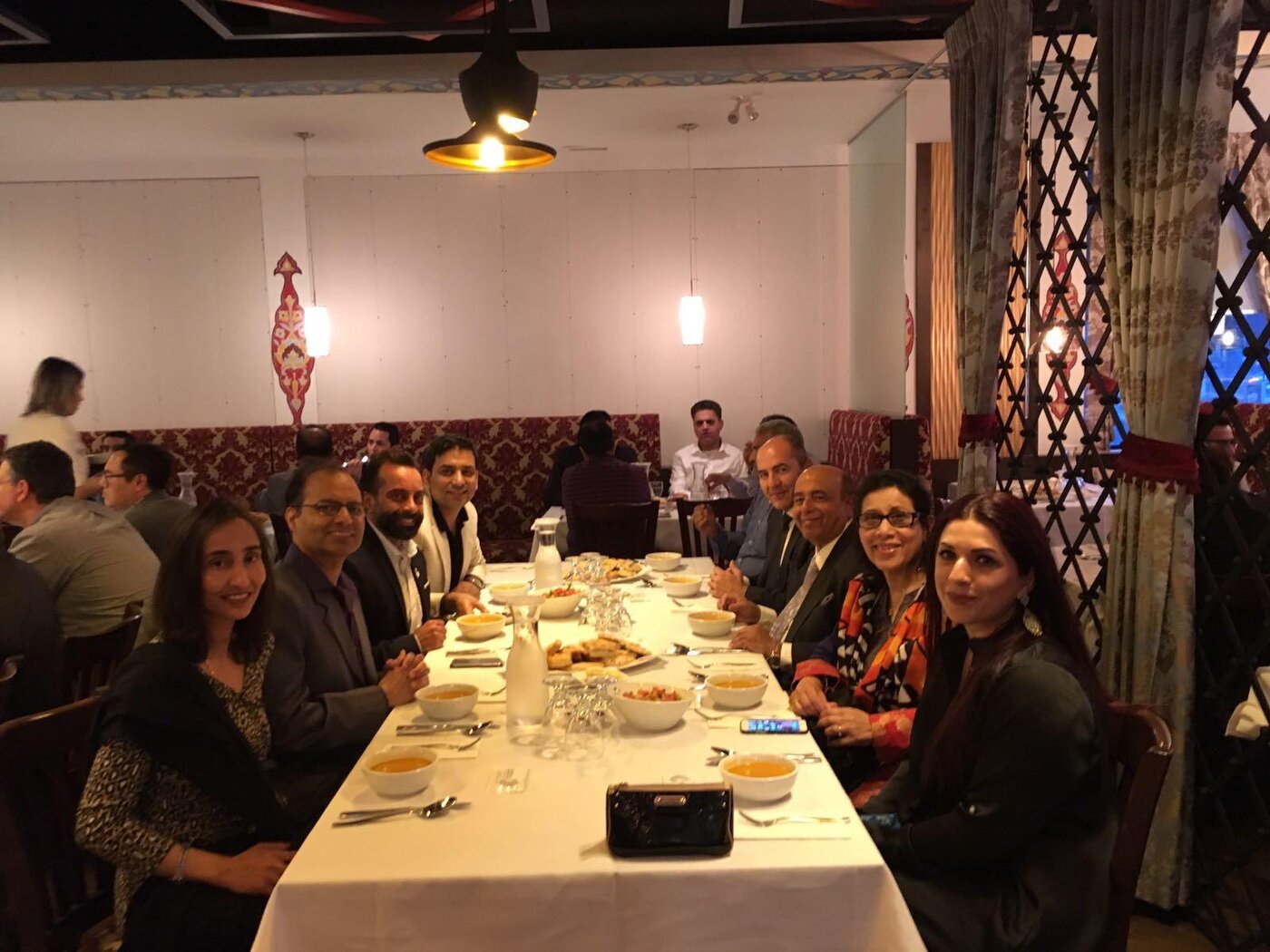 Community members around a dinner table
