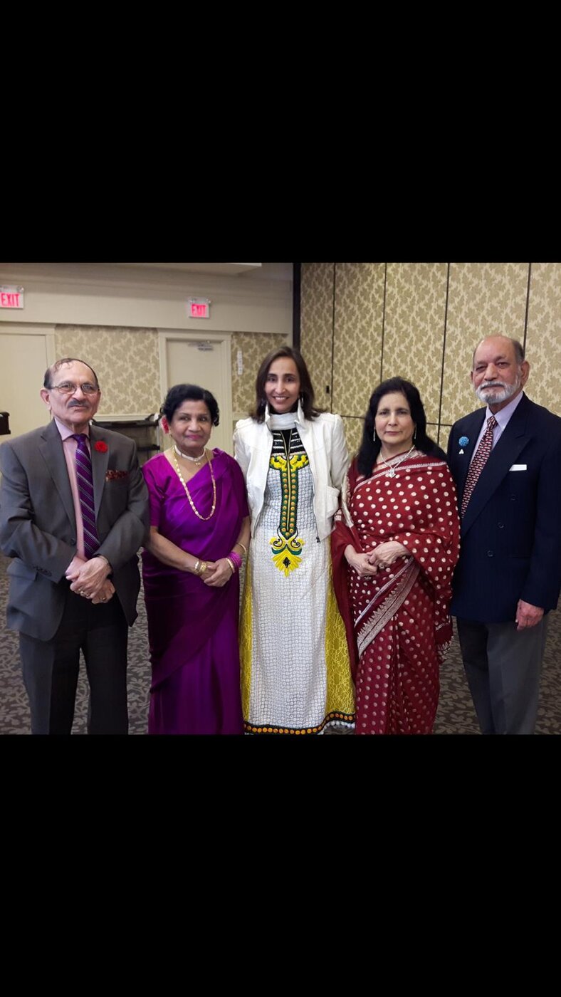 Naila with a delegation at a community gala
