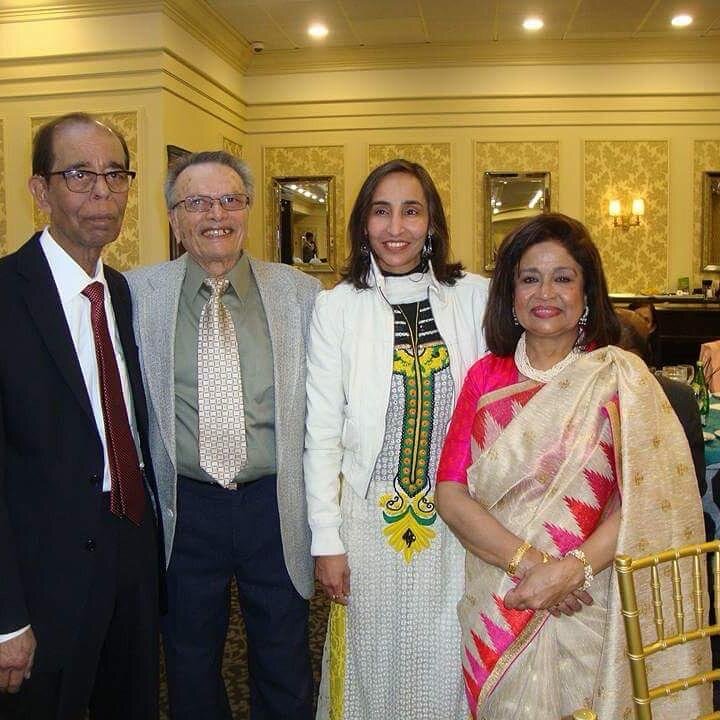 Naila among community friends at a gala