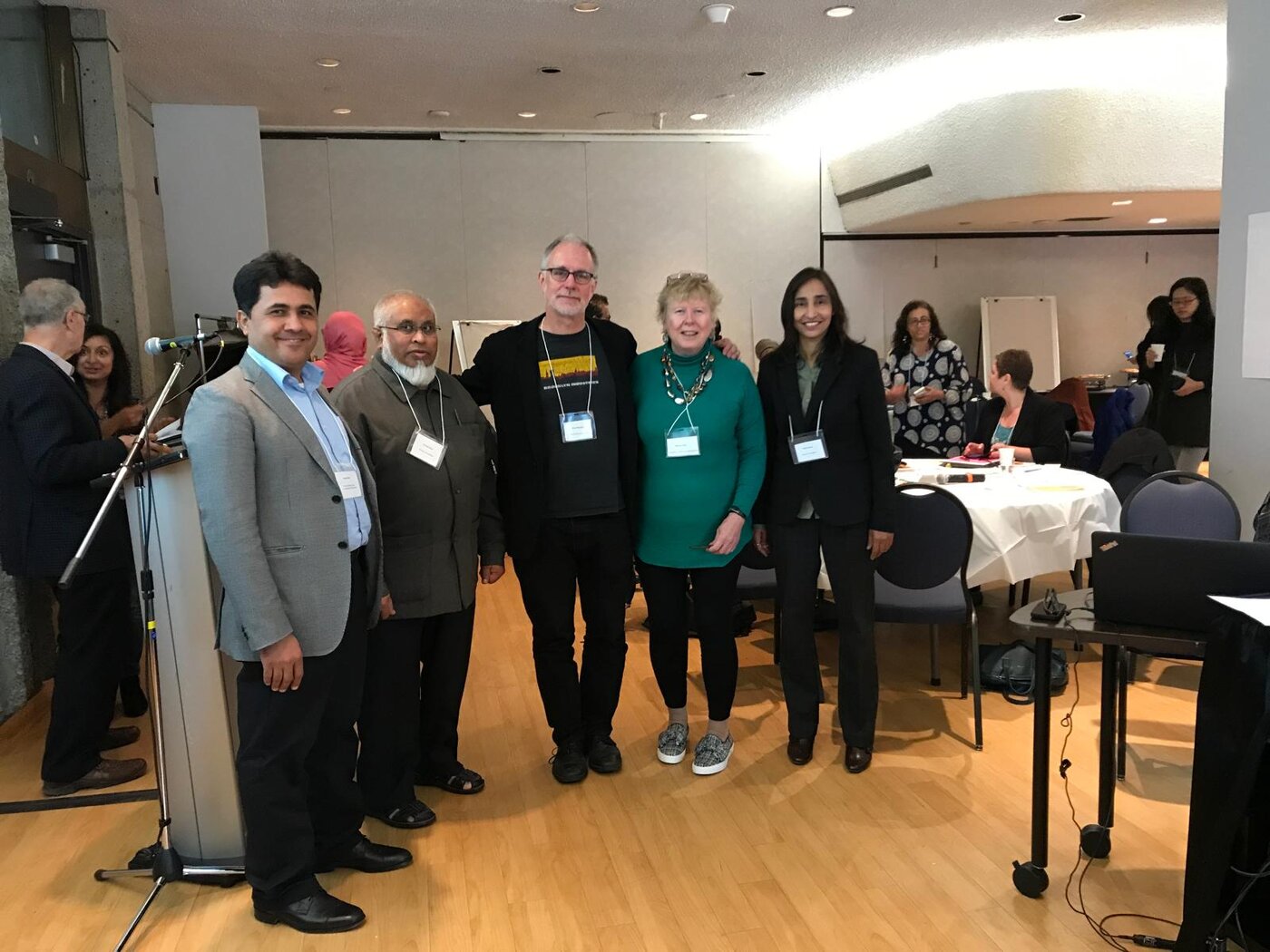 Naila with business and community leaders at a panel
