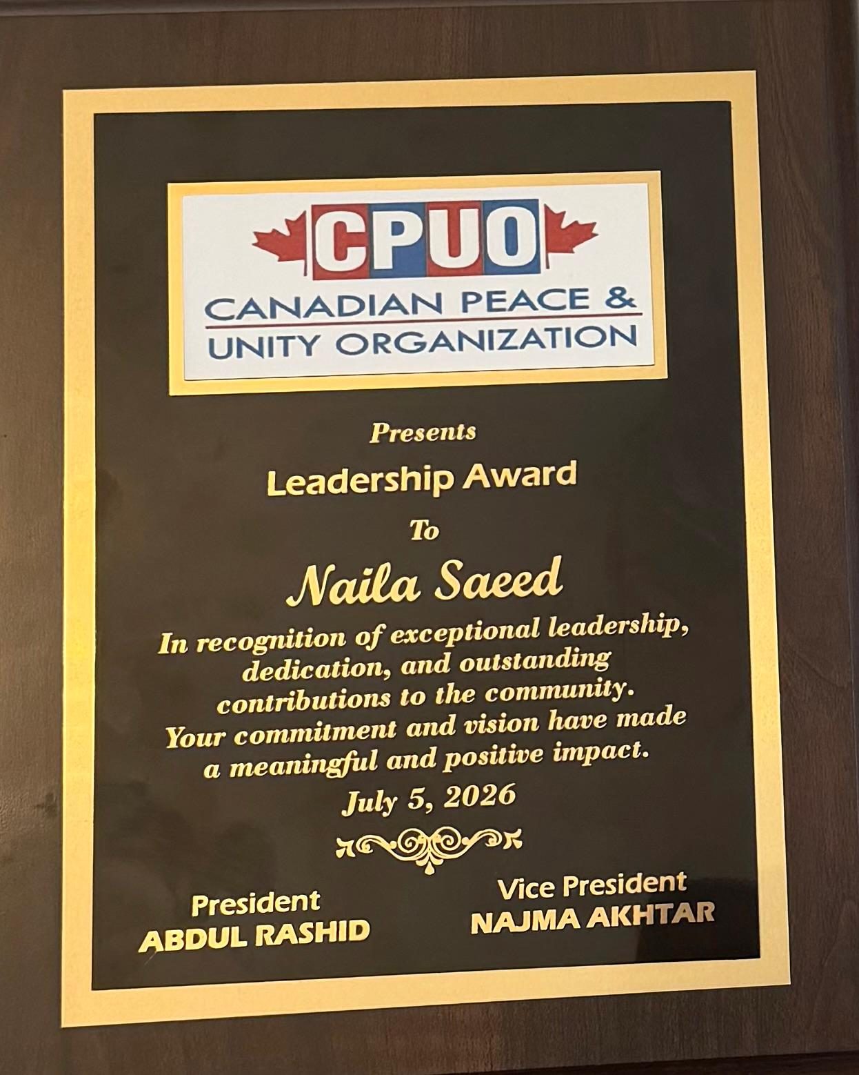 Leadership Award plaque from the Canadian Peace and Unity Organization presented to Naila Saeed