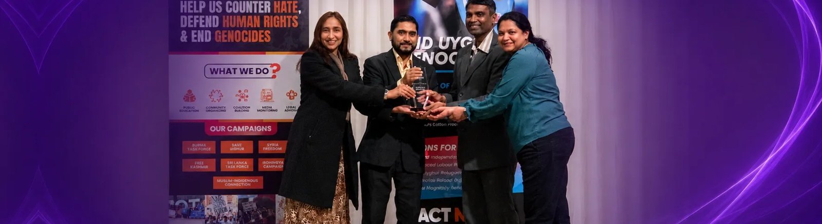 Naila receiving an award at a community recognition event