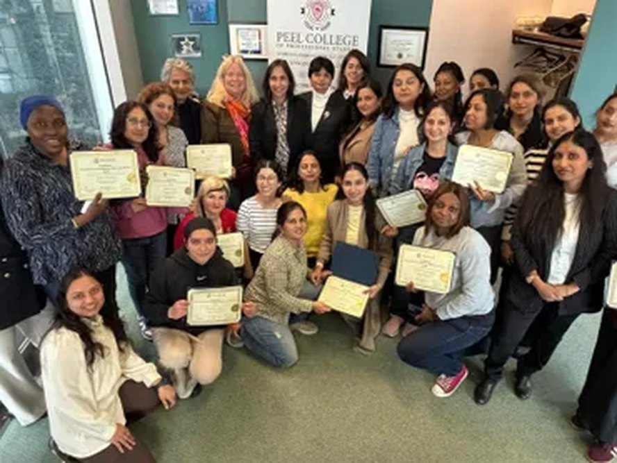 Youth receiving certificates at a mentorship event